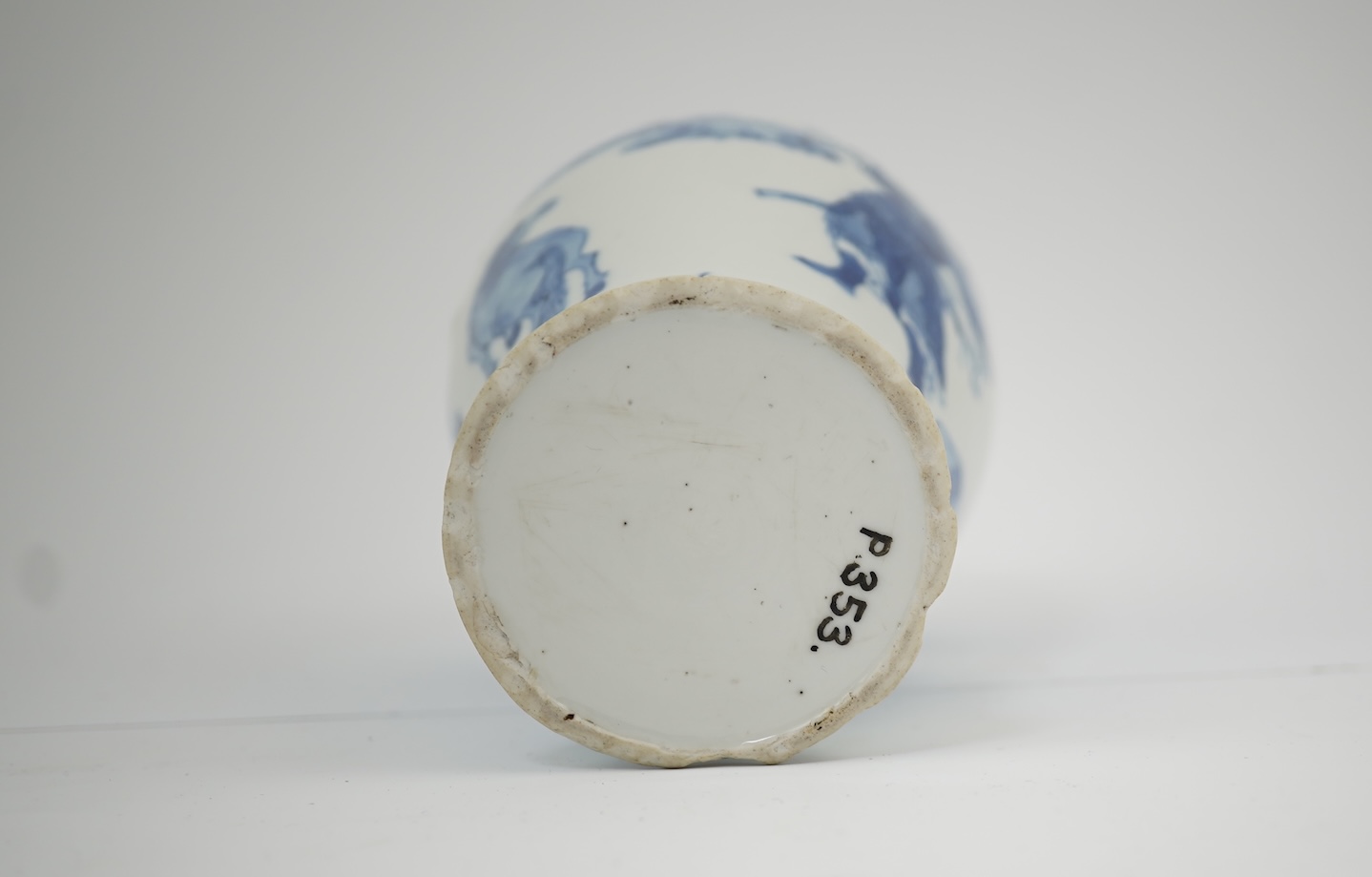 A Chinese blue and white baluster vase, early Kangxi, and associated cover